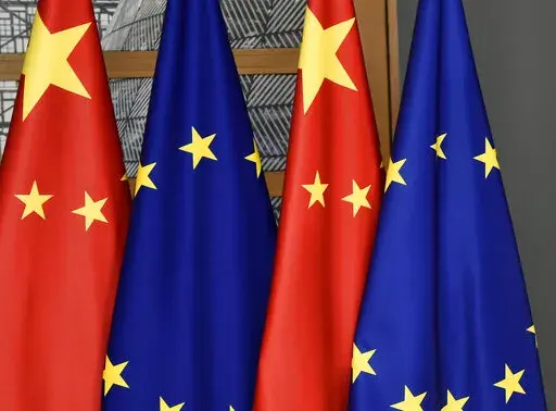 EU and Chinese flags are seen at the Europa building in Brussels, Tuesday, Dec. 17, 2019. The European Union will seek China's assurances that it won't assist Russia in circumventing economic sanctions leveled over the invasion of Ukraine at an annual summit Friday, April 1, 2022. (John Thys/Pool Photo via AP, File)