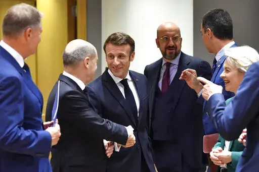 From left, Romania's President Klaus Werner Ioannis, Germany's Chancellor Olaf Scholz, France's President Emmanuel Macron, European Council President Charles Michel, Spain's Prime Minister Pedro Sanchez and European Commission President Ursula von der Leyen during a round table meeting at an EU summit in Brussels, Friday, Oct. 21, 2022. European Union leaders are gathering Friday to take stock of their support for Ukraine after President Volodymyr Zelenskyy warned that Russia is trying to spark 