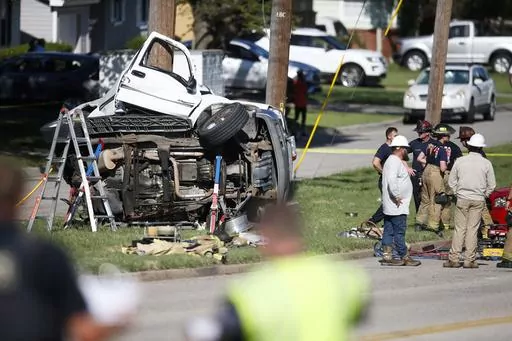 Emergency workers work the scene of a fatal accident on Aug. 24, 2021 in Tulsa, Okla. Nearly 43,000 people died in U.S. traffic crashes in 2021, with deaths due to speeding and impaired or distracted driving on the rise. The 2021 final numbers, released Monday, April 3, 2023 by the National Highway Traffic Safety Administration, confirmed earlier estimates showing a 10.5% increase in deaths over 2020. (Michael Noble Jr./Tulsa World via AP, File)