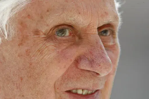 Pope Benedict XVI smiles during a Mass in St. Peter's Square celebrated by 15,000 white-robed priests, all marking the end of the Vatican's Year of the Priest, on June 11, 2010. Pope Benedict XVI rarely got credit for having turned the Vatican around on clergy sexual abuse, but as cardinal and pope, he pushed through revolutionary changes to church law to make it easier to defrock predator priests. (AP Photo/Pier Paolo Cito, File)