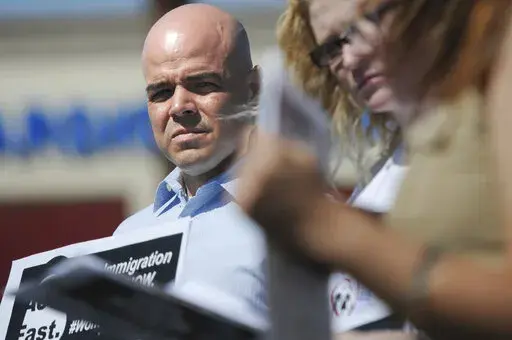 In this March 24, 2014, file photo, Immigration Reform for Nevada supporter Robert Telles is seen during an event outside the office of U.S. Rep. Joe Heck, R-Nev., in protest of Congress not taking action on comprehensive immigration reform. Police say they are serving search warrants in connection with the fatal stabbing of a Las Vegas newspaper reporter last week. In a statement Wednesday, Sept. 7, 2022 Metro Police didn’t specify where they were searching in connection with the death of rep