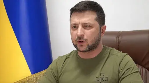 In this image from video provided by the Ukrainian Presidential Press Office and posted on Facebook, Ukrainian President Volodymyr Zelenskyy speaks to members of the U.S. Congress from Kyiv, Ukraine, on Wednesday, March 16, 2022. Zelenskyy summoned the memory of Pearl Harbor and the Sept. 11, 2001, terror attacks in appealing to the U.S. Congress to do more to help Ukraine's fight against Russia. President Joe Biden said the U.S. is sending more anti-aircraft, anti-armor weapons and drones. (Ukr