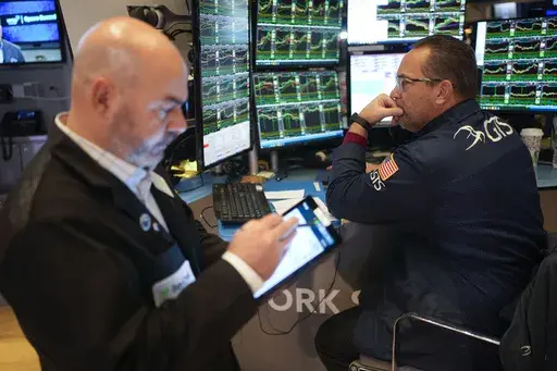 Traders work on the floor at the New York Stock Exchange in New York's Financial District Thursday, Jan. 2, 2025. (AP Photo/Seth Wenig)
